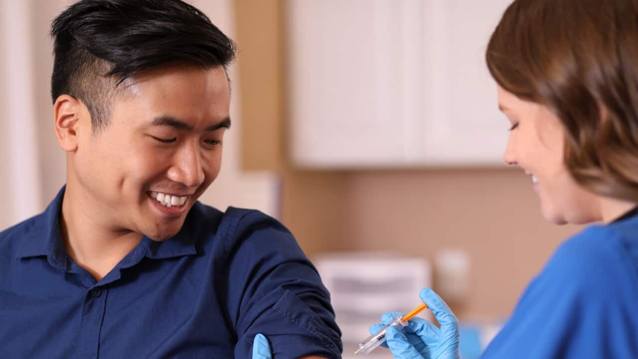 A young man getting flu shot