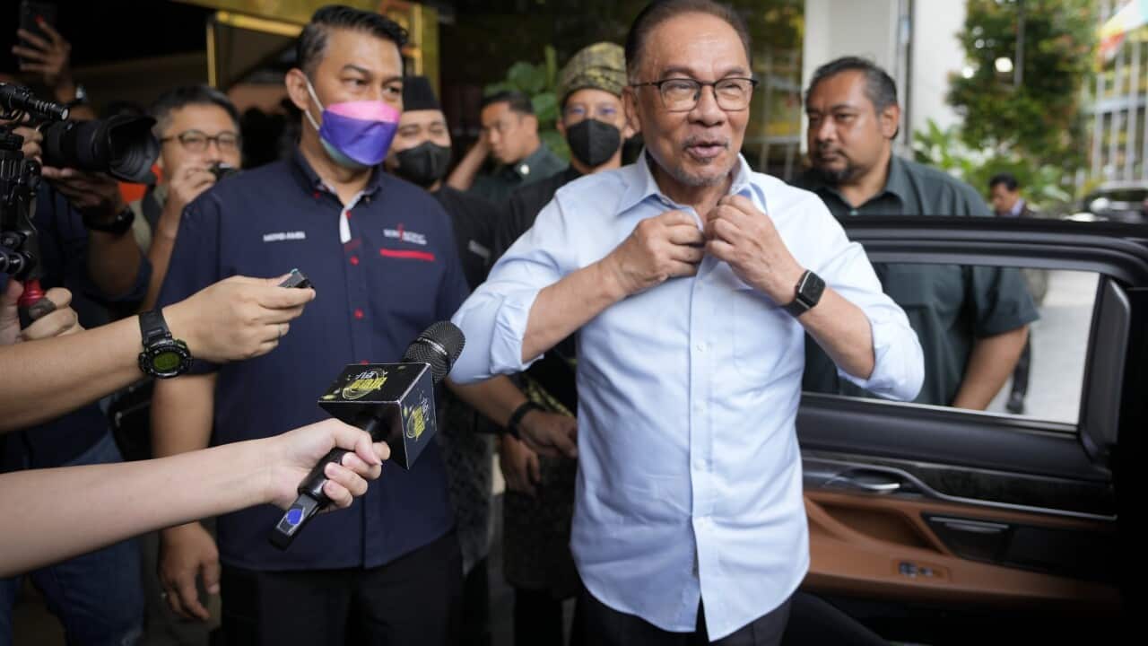 Malaysian opposition leader Anwar Ibrahim arrives at a hotel to meet the leaders of United Malays National Organization in Kuala Lumpur on 21 November 2022.