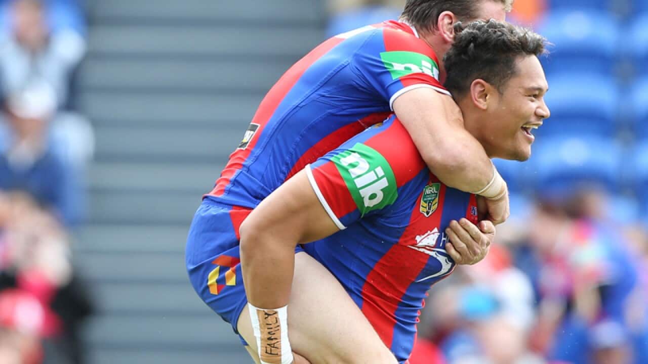 Kurt Gidley hops on the back of Joey Leilua