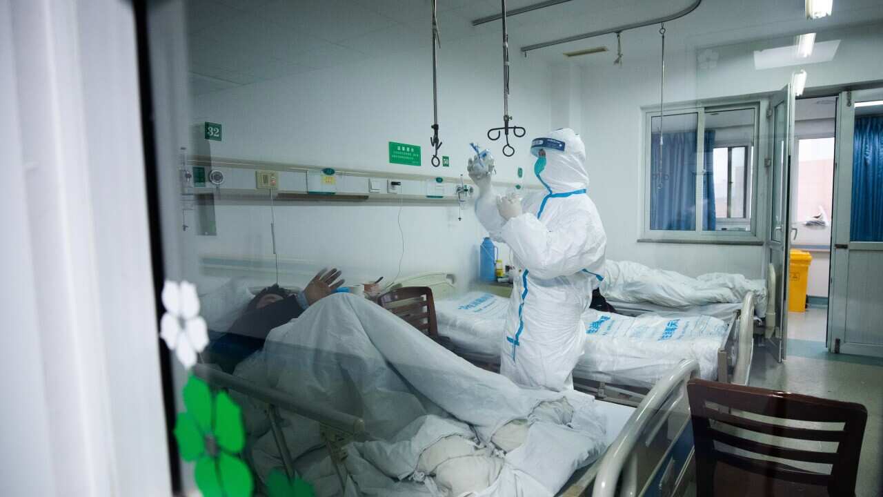 Medical staff work at Wuhan Jinyintan hospital, which specialises in the treatment of coronavirus.