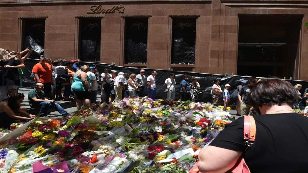 Crowds and flowers outside Sydney's Lindt cafe