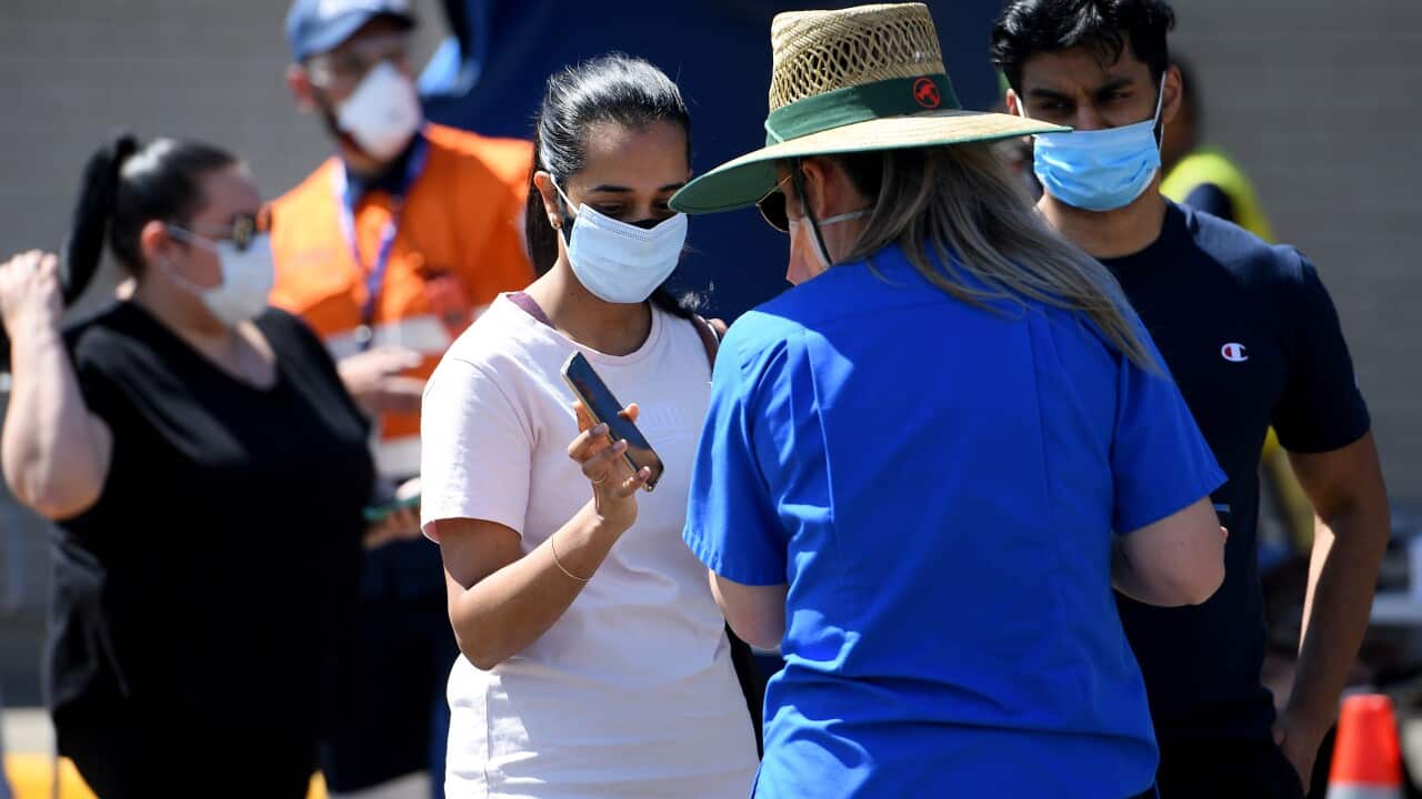 People are seen arriving at the South Western Sydney Vaccination Centre, at Macquarie Fields, Sydney, Friday, September 24, 2021.