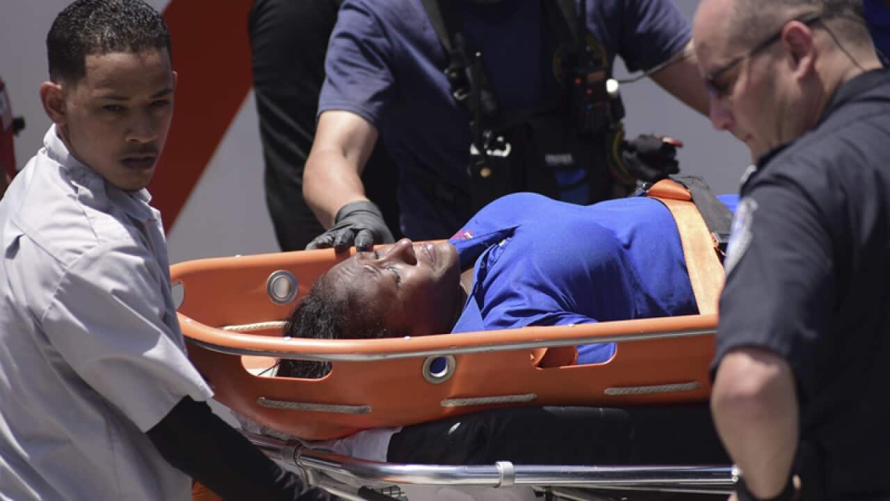 A woman is transported after being rescued from a cruise ship fire