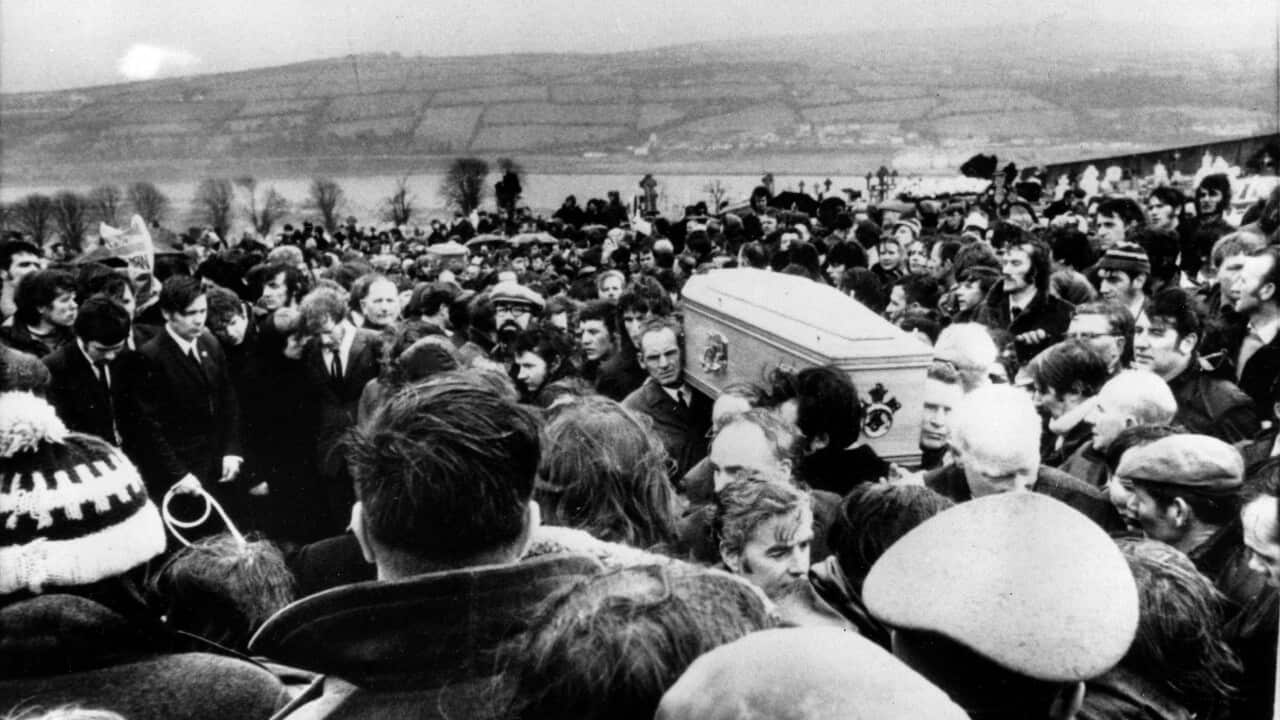 Pallbearers carry one of 13 coffins of Bloody Sunday victims to a graveside during a funeral in Derry, Northern Ireland, following requiem mass at nearby St. Mary's church at Creggan Hill on in this b/w Feb. 2, 1972 file photo.