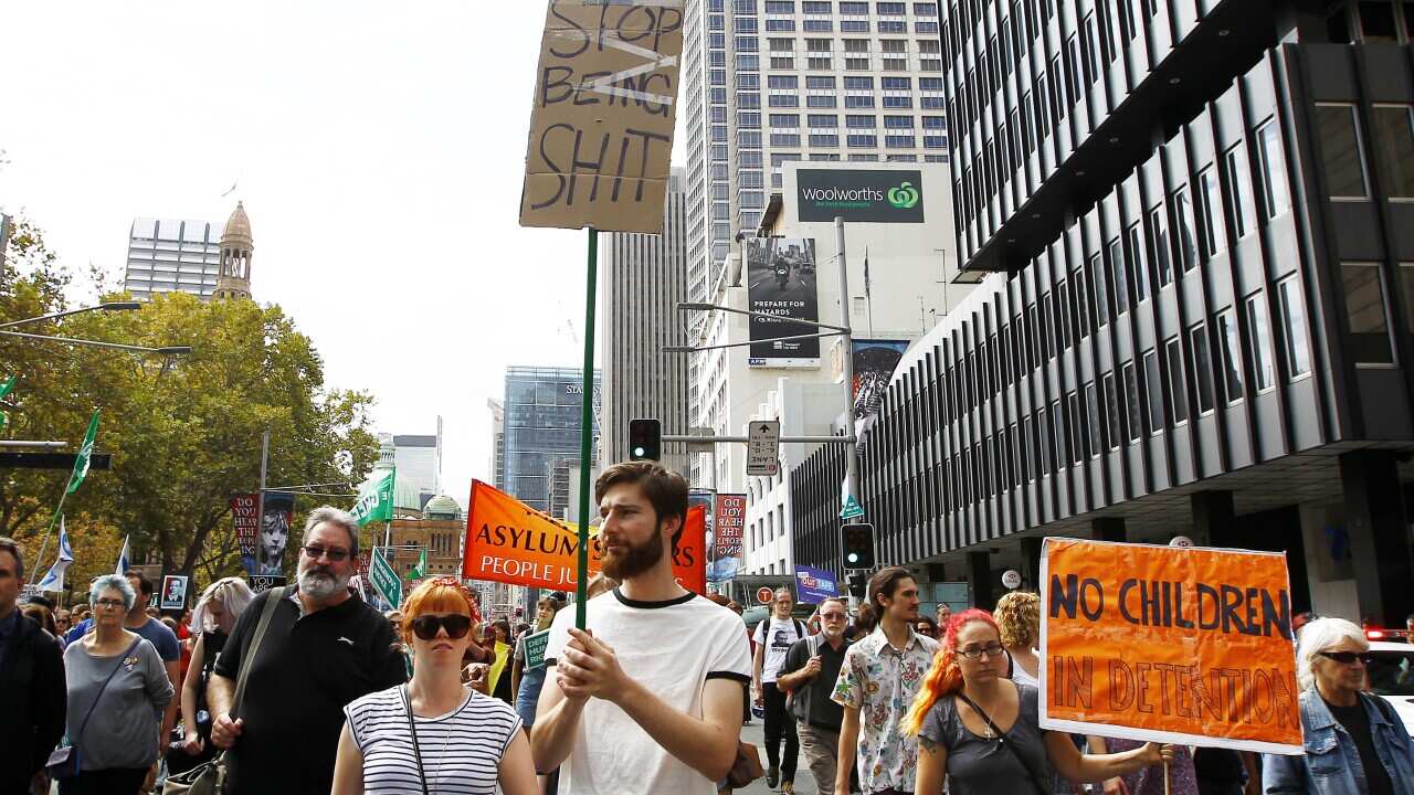 People rally and march in the anti government protest