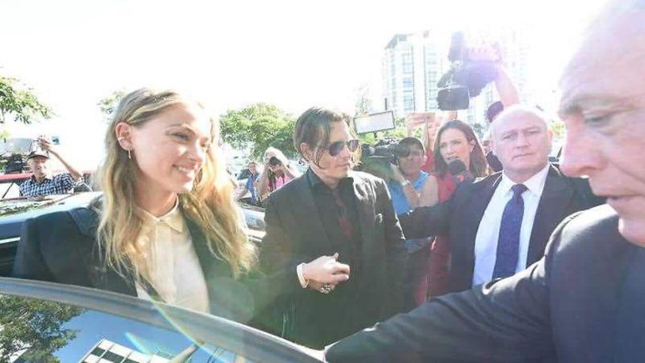 Johnny Depp and wife Amber Heard arrive at the Southport Magistrates Court on the Gold Coast. (AAP)