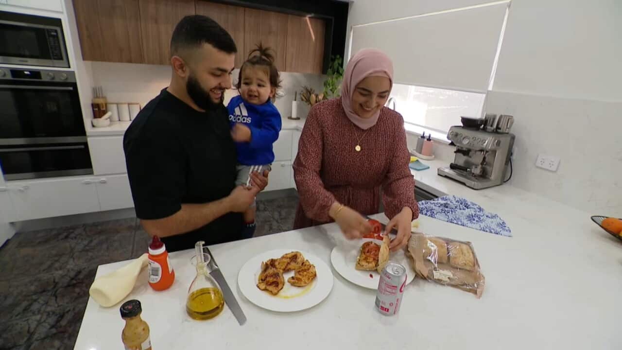 Jamil Awwad, Juman Abdoh and their son preparing a Halal meal in Sydney - May 12, 2023 SBS News .jpg
