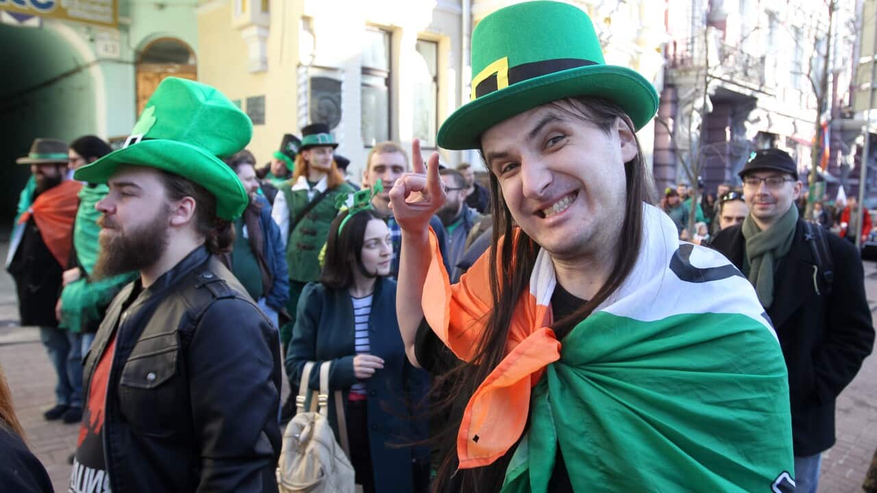 A participants seen dressed in green and with an Irish flag