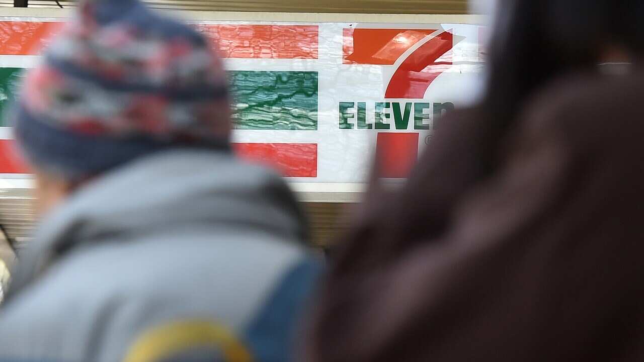 7-Eleven corporate signage is seen in Melbourne, Monday, Aug. 31, 2015. A joint Fairfax-Four Corners investigation found up to two-thirds of 7-Eleven stores could be underpaying workers. (AAP Image/Julian Smith) NO ARCHIVING