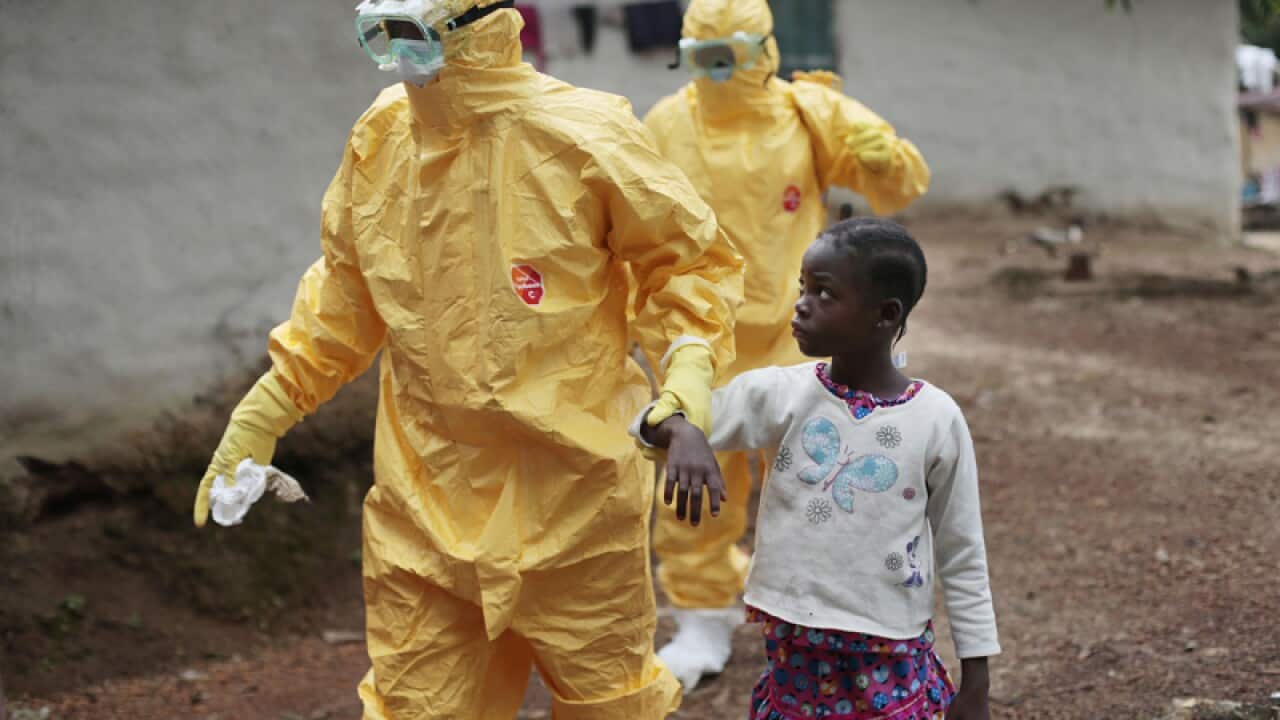 Nowa Paye, 9, is taken to an ambulance