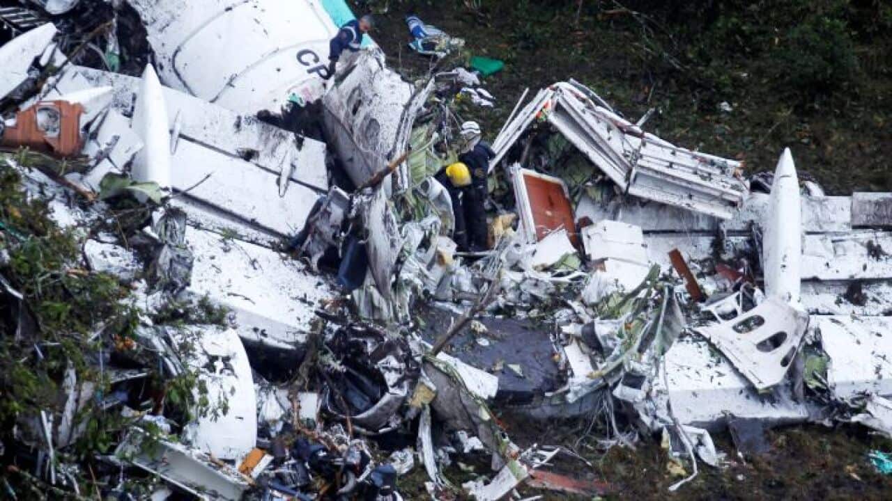 Rescue crew work at the wreckage from a plane that crashed into Colombian jungle with Brazilian soccer team Chapecoense near Medellin, Colombia, November 29, 2016.