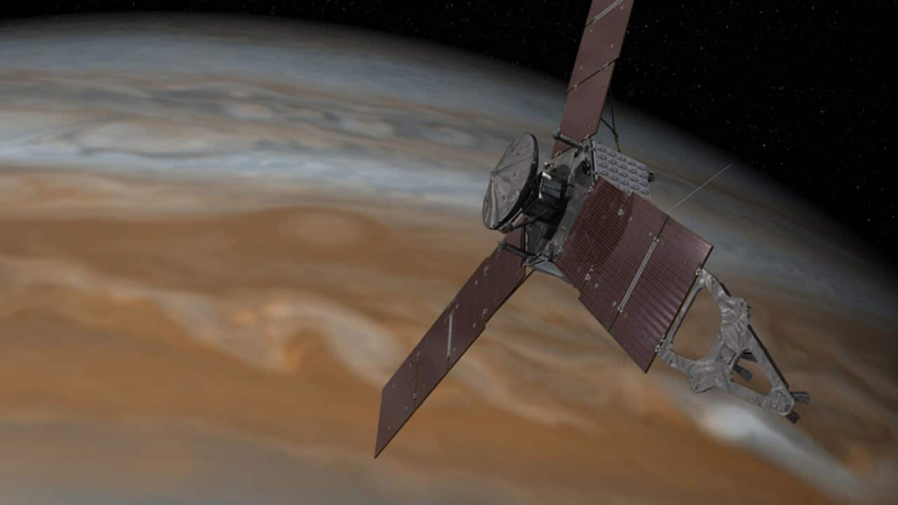 This artist's rendering shows the Juno spacecraft above Jupiter
