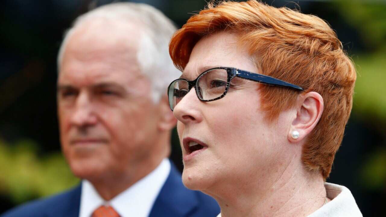 Marise Payne, with Malcolm Turnbull behind her