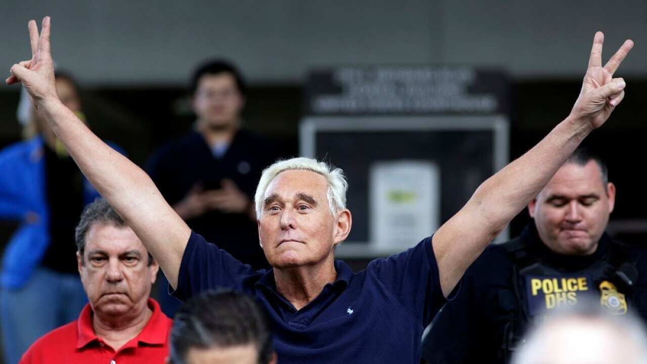 Former campaign adviser for President Donald Trump, Roger Stone walks out of the federal courthouse on Friday.