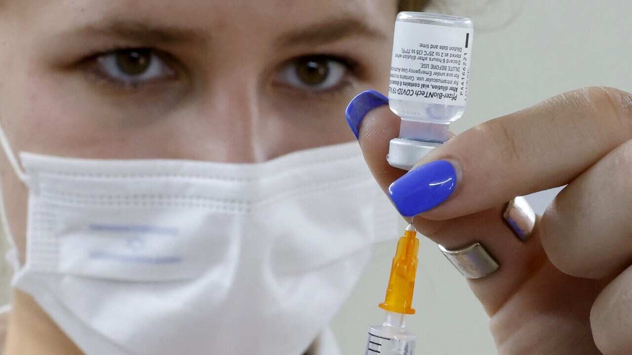 An Israeli medical worker prepares a dose of the PfizerBioNTech Covid-19 vaccine