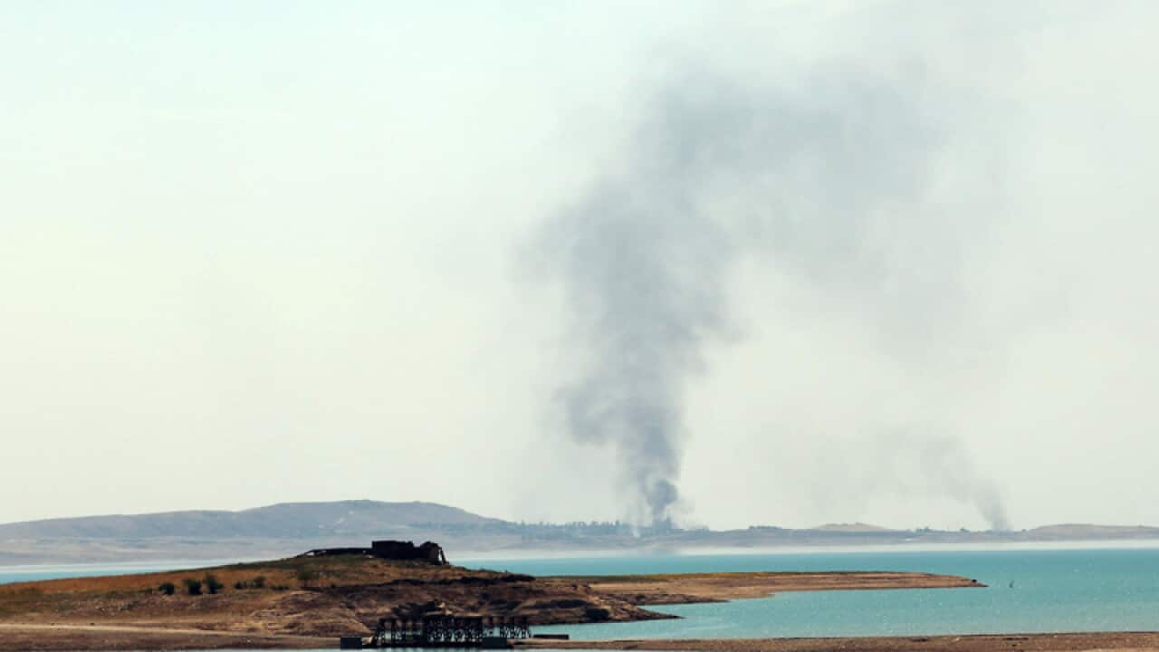 Smoke rises during airstrikes targeting IS militants outside Mosul