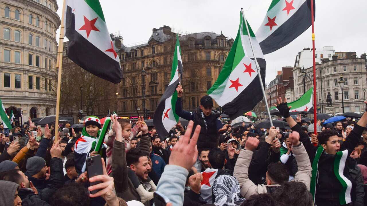 Syrians celebrate the toppling of Bashar al Assad regime in Trafalgar Square, London, UK - 08 Dec 2024