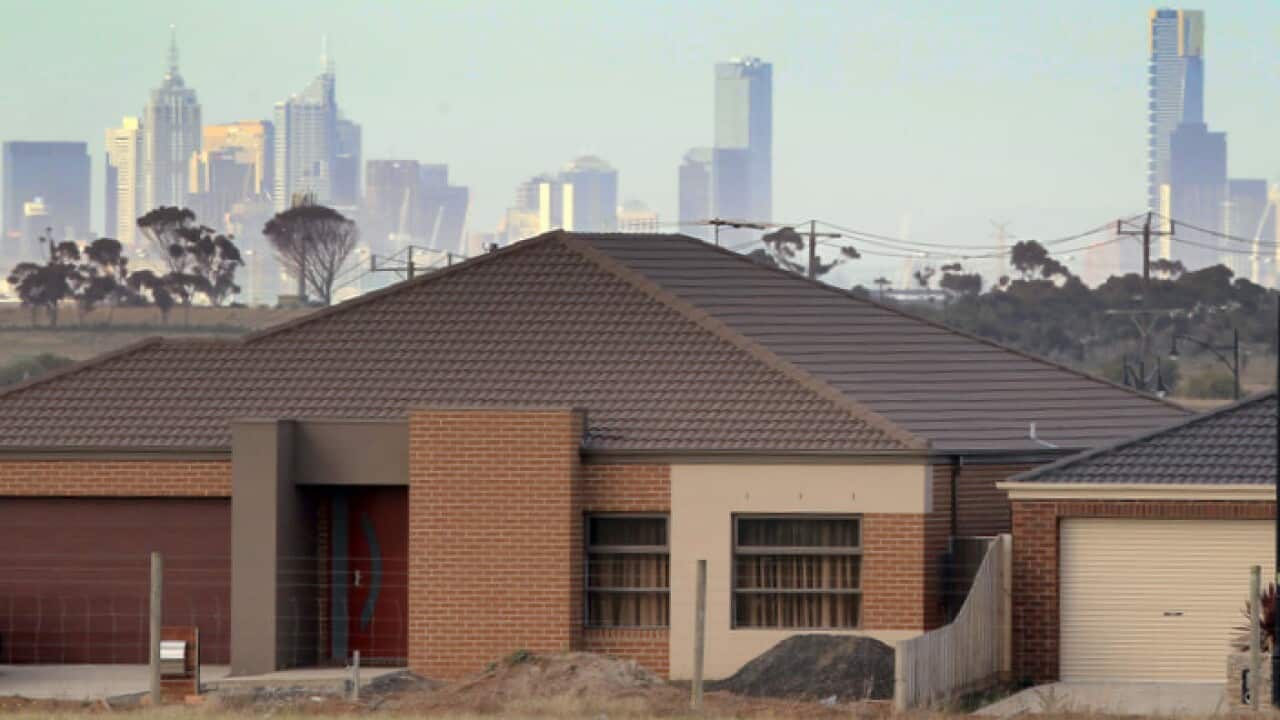 Melbourne's city centre towers above suburban housing