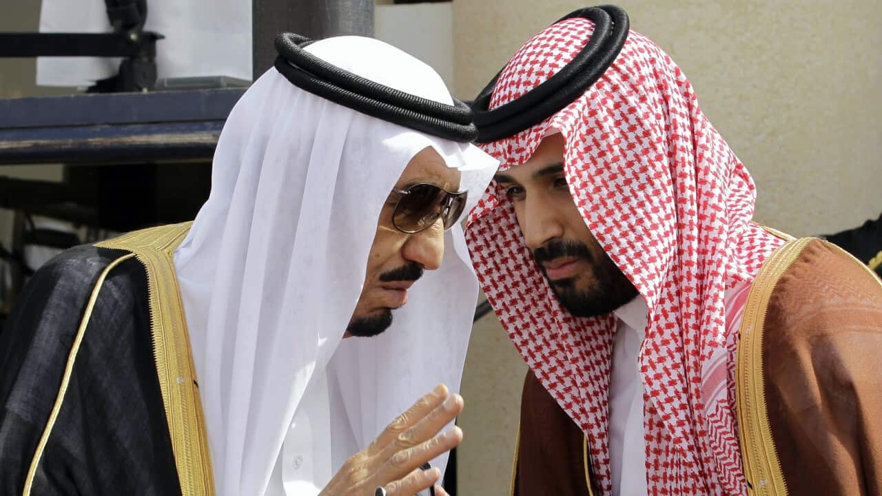 Crown Prince Salman bin Abdul-Aziz Al Saud, left, speaks with his son Prince Mohammed ahead of the opening of Gulf Cooperation Council,