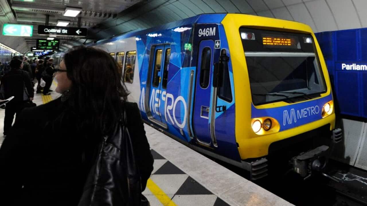 A Metro train approaches Parliament station in Melbourne