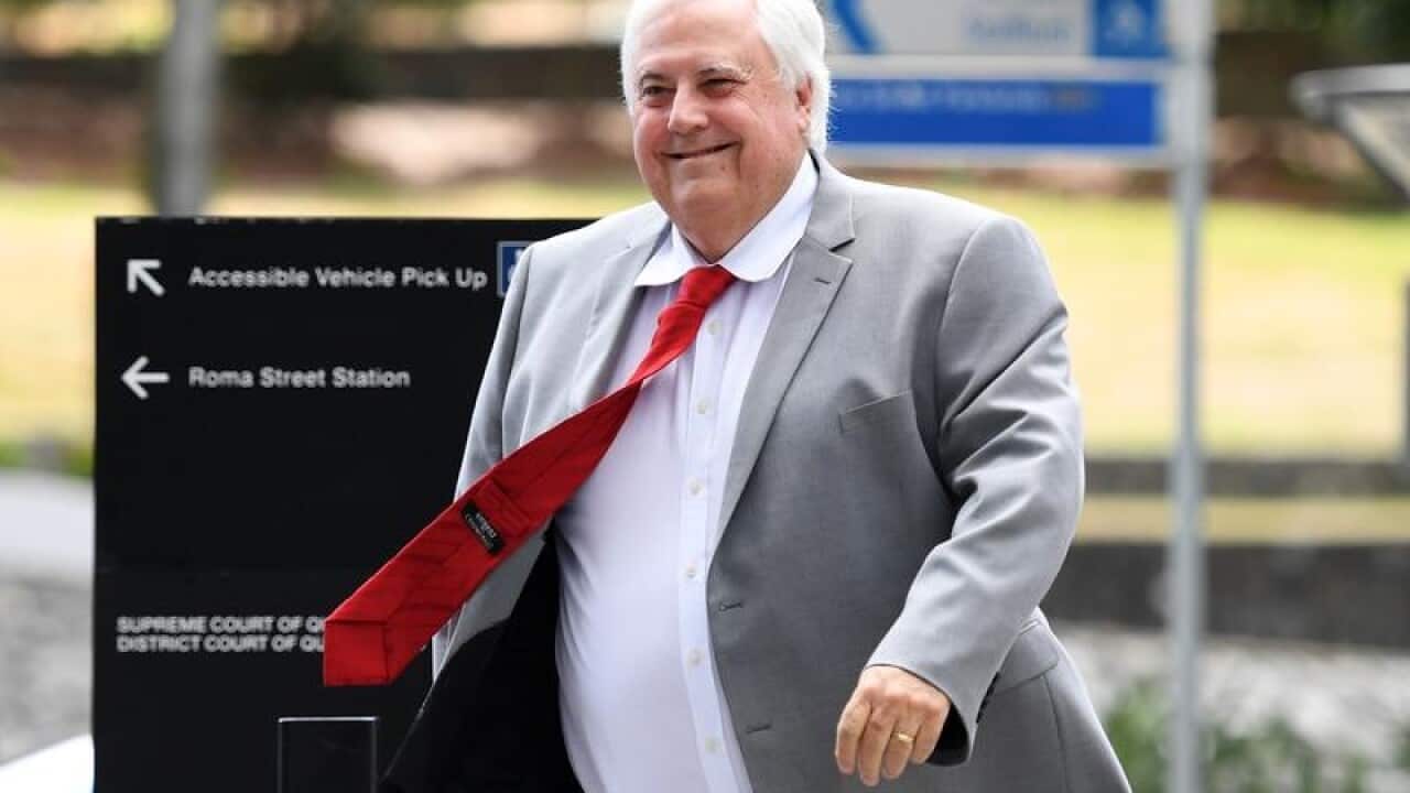 Clive Palmer arrives at the Supreme Court in Brisbane.