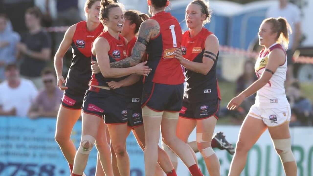 Demons celebrate after Daisy Pearce scores a goal during the Round 5.