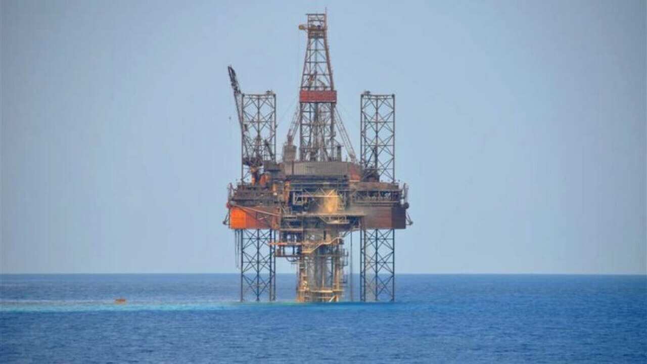 A gas drilling structure in the middle of the sea.