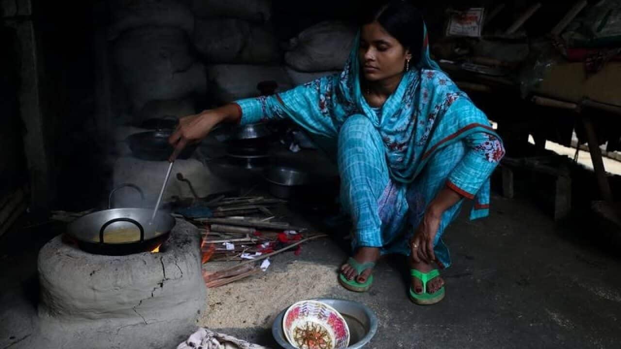 21-year-old, Tania, prepares a meal.