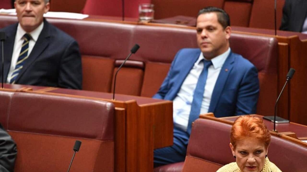 Mathias Cormann (L) in Senate