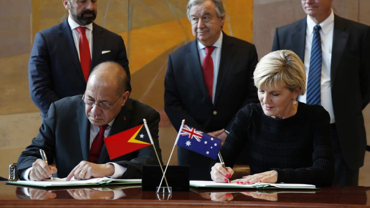 East Timorese minister Agio Pereira and Australian foreign minister Julie Bishop sign the treaty at the United Nations headquarters.