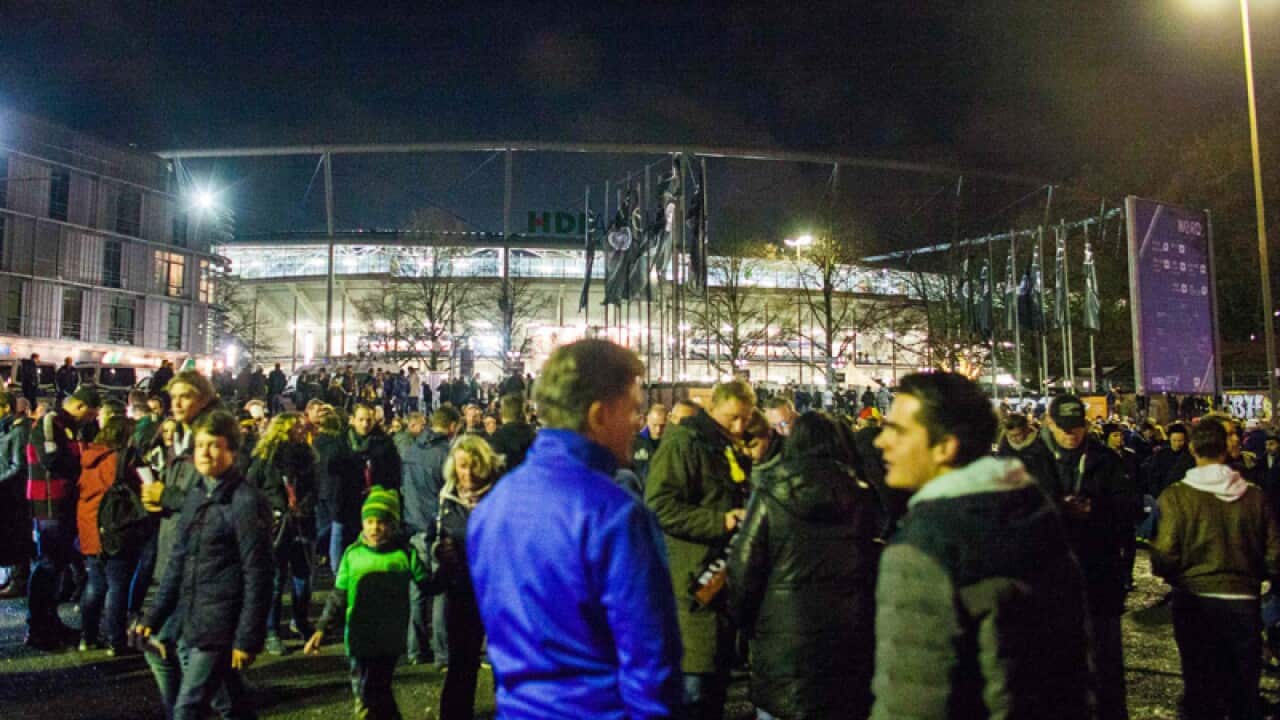Fans outside the HDI Arena stadium in Hanover