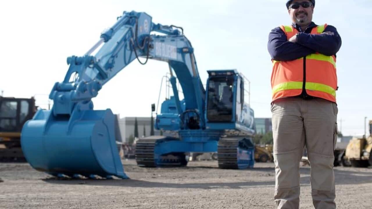 A Winslow Constructors worker pictured with 'Big Blue'