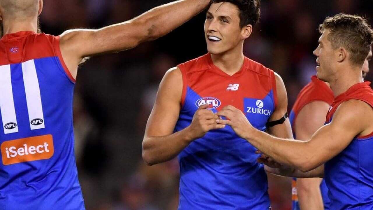 Sam Weideman is congratulated by teammates