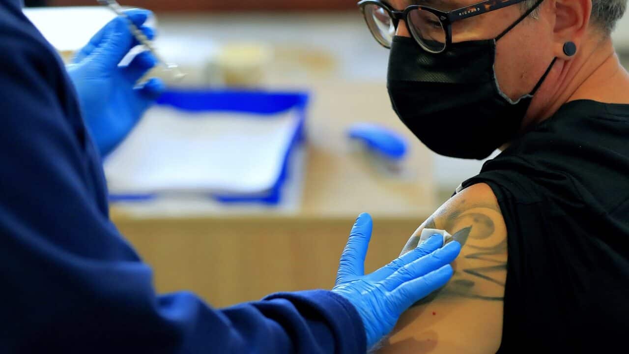 A Romanian man receives a Pfizer vaccine dose
