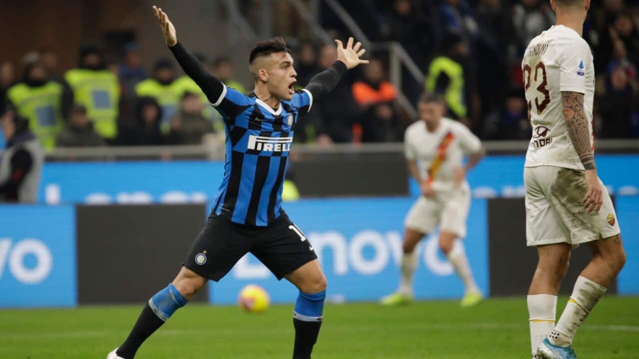 Inter Milan's Lautaro Martinez reacts during a Serie A soccer match between Inter Milan and Roma, at the San Siro stadium in Milan.
