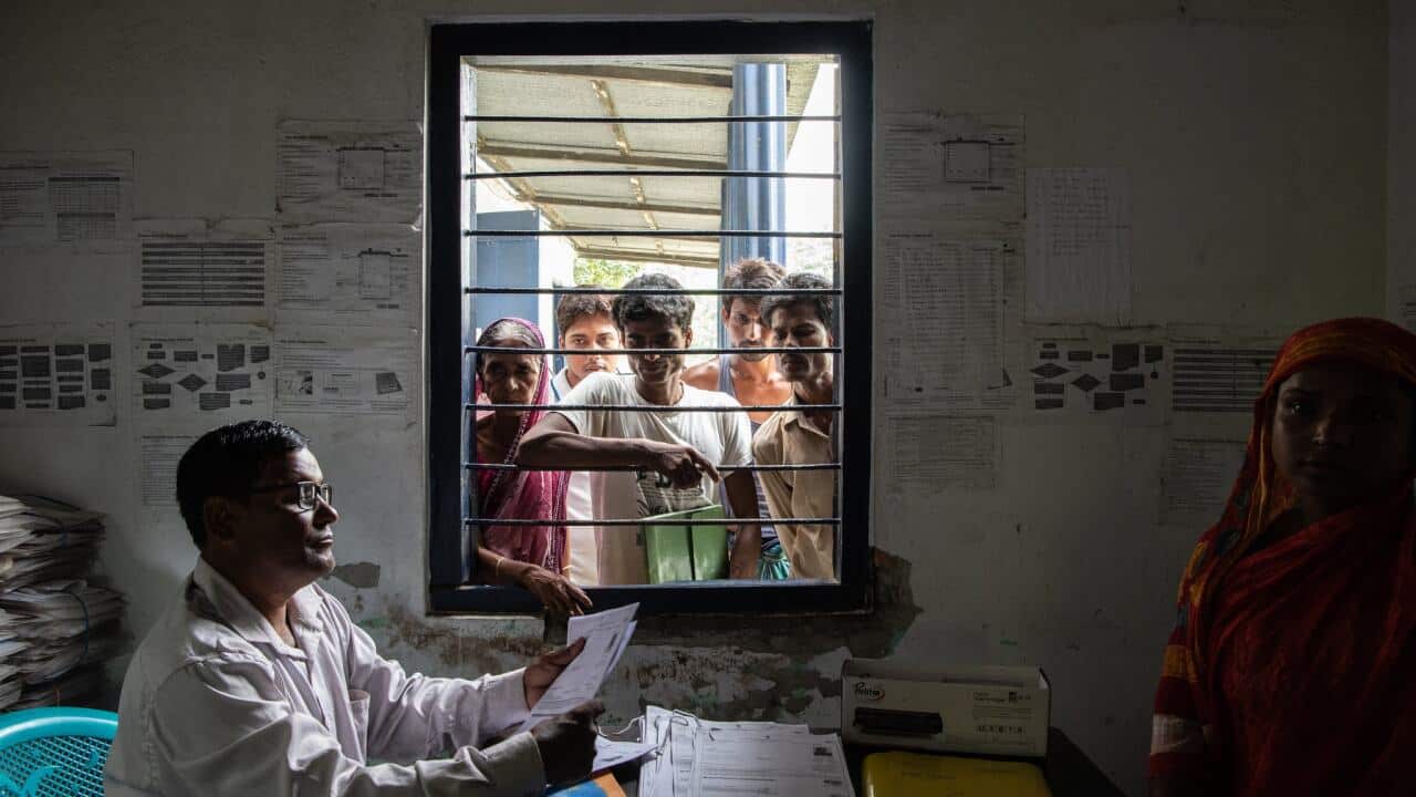 A government official in Kharupetia, in the Indian state of Assam, collected documents from people hoping to be included on an official list of Indian citizens. The citizenship of millions is at risk.