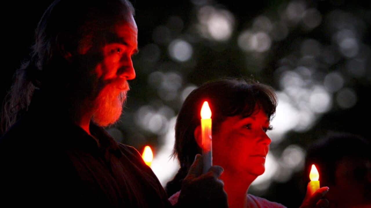 Residents at a dawn memorial service in Grantham, a year on. (AAP)