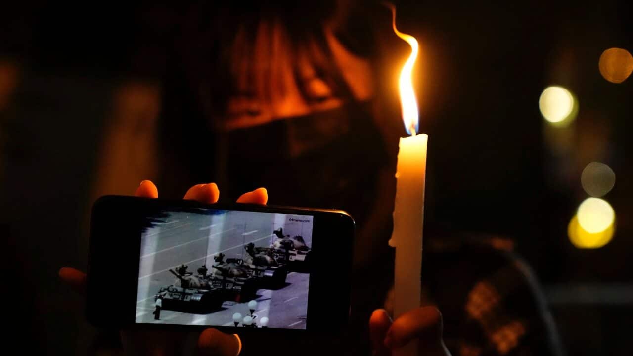 Outside the Victoria Park in Hong Kong, people lights up candles to mark the anniversary of the Tiananmen Square crackdown.