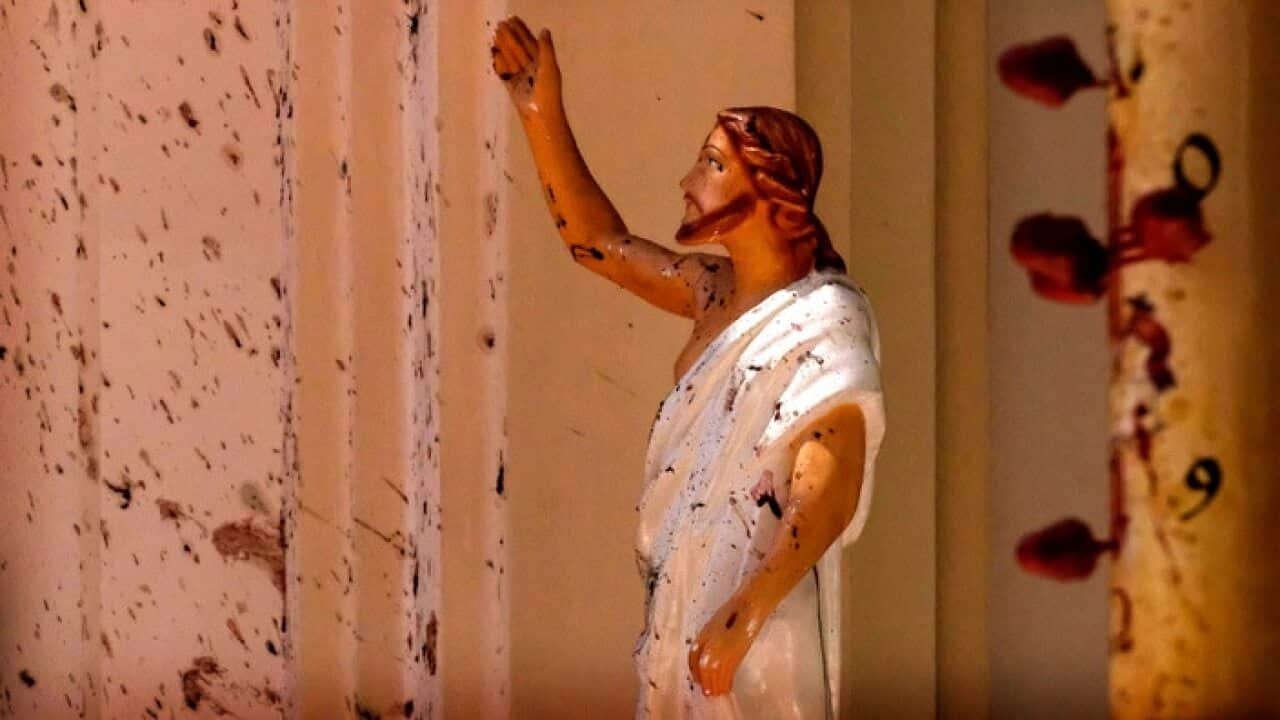 Blood stains on a wall and on a statue at St Sebastians Church in Negombo, north of Colombo