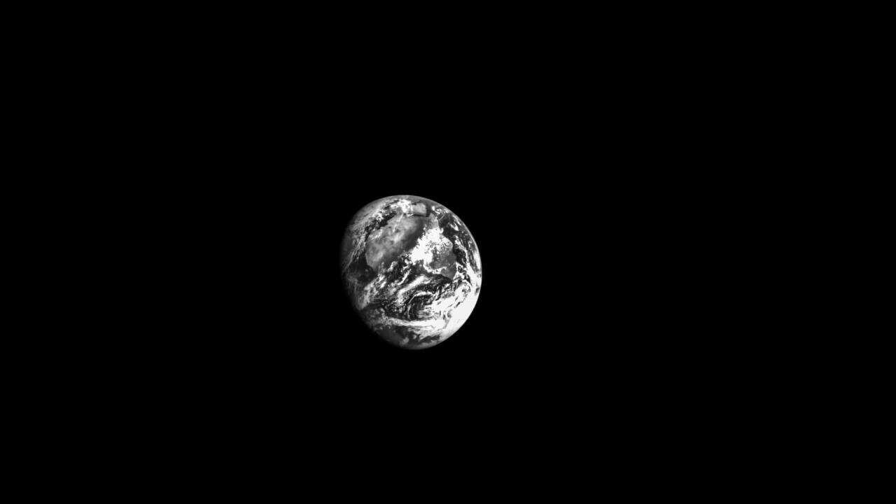 Orion Spacecraft Takes Stunning Black-and-White Photo Of Earth During Moon Trip