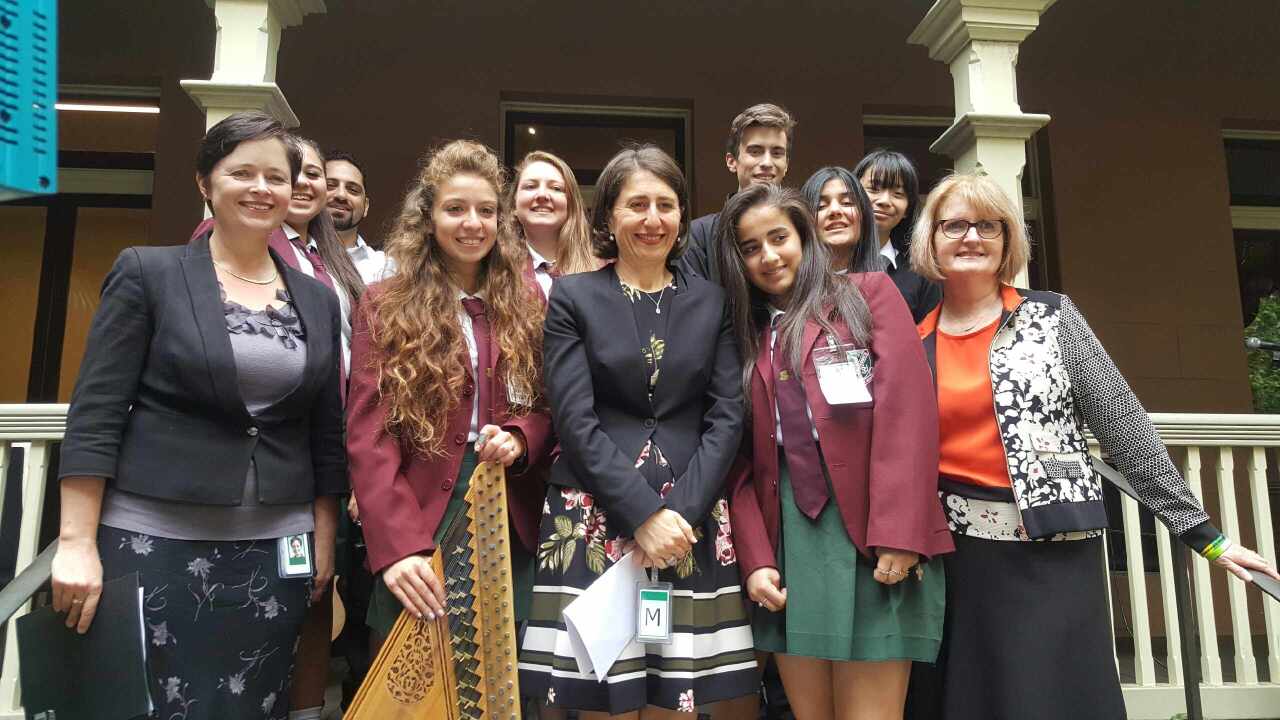 NSW Premier Gladys Berejiklian meets Iraqi and Syrian refugees, now musicians and students in western Sydney.
