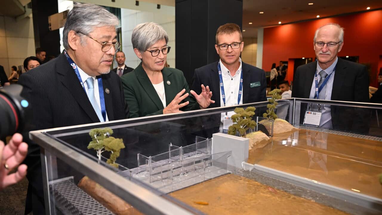 Australian Foreign Minister Penny Wong (second left) and Philippines Secretary of Foreign Affairs Enrique Manalo (left) view a FishTech display ahead of a keynote address during the 2024 ASEAN-Australia Special Summit at the Melbourne Convention and Exhibition Centre in Melbourne, Monday, 4 March 2024.