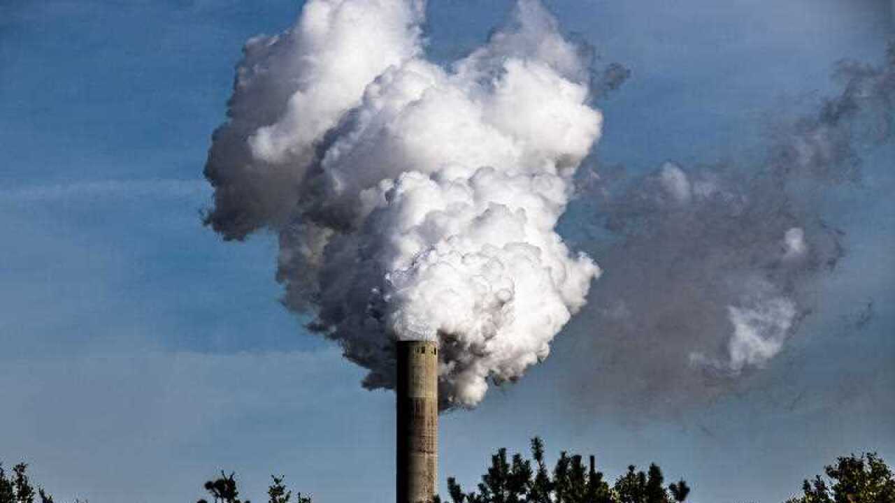 Smoke comes out of a chimney.
