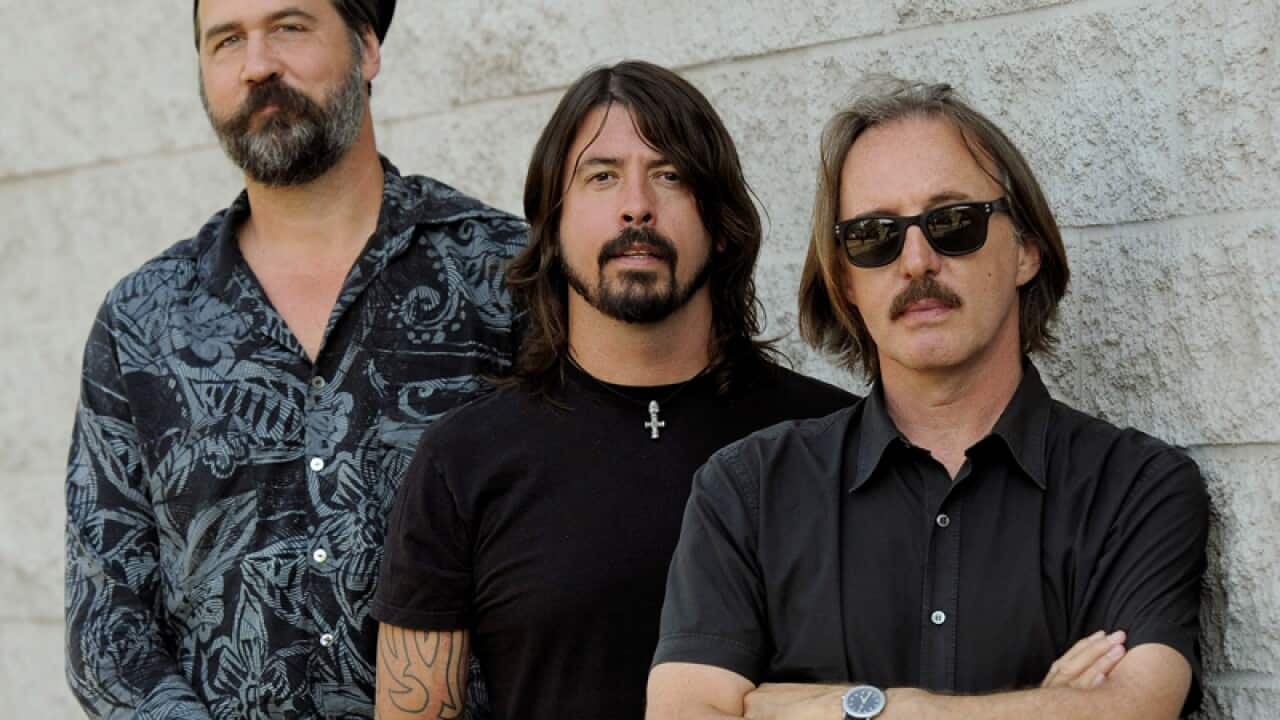 Krist Novoselic, left, and Dave Grohl and producer Butch Vig.