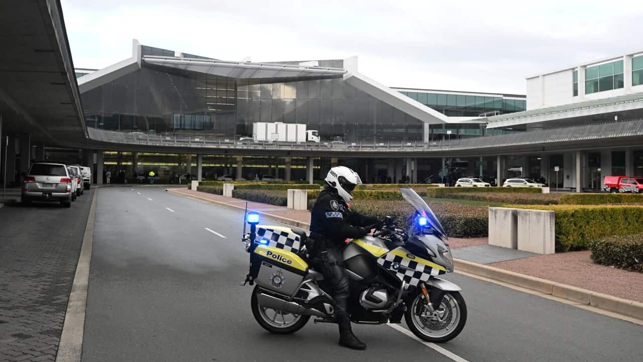 Australian Federal Police are seen after a shooting where a man fired at least three shots from a pistol at Canberra Airport, Sunday 14 August 2022.