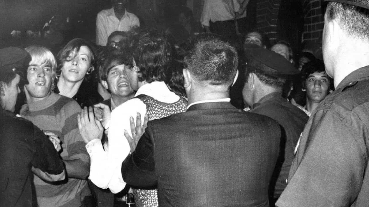 The crowd attempts to impede police arrests outside the Stonewall Inn in Greenwich Village