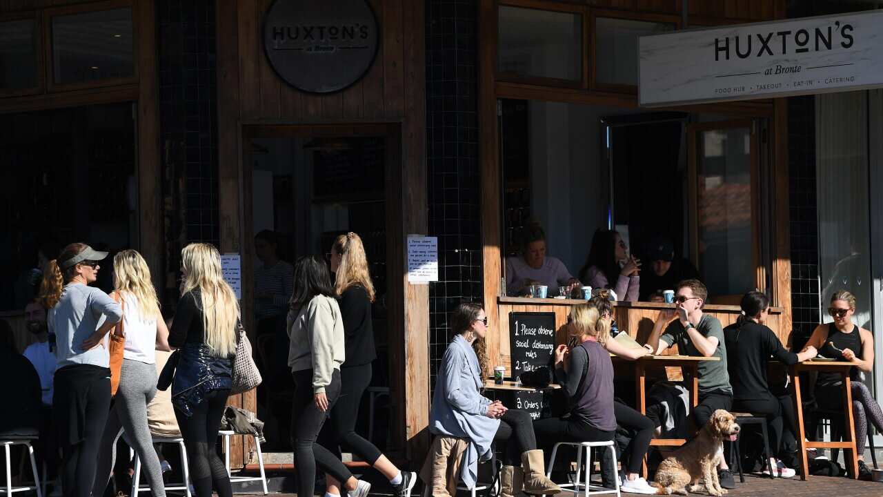 Diners seen at a cafe in Bronte in Sydney in July.