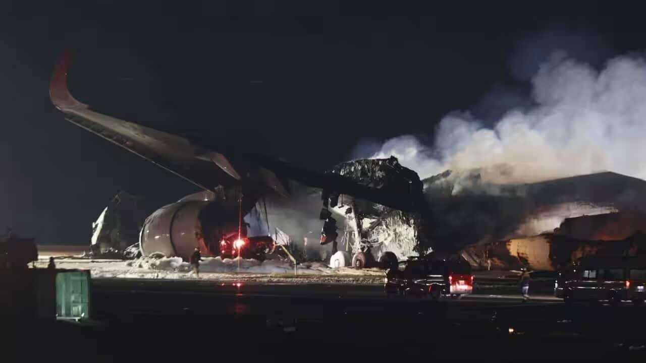 The Japan Airlines plane carrying 367 passengers and 12 crew crashed with a Japan Coast Guard plane transporting relief supplies for earthquake disaster area. Source: AAP/ Jiji Press.jpg