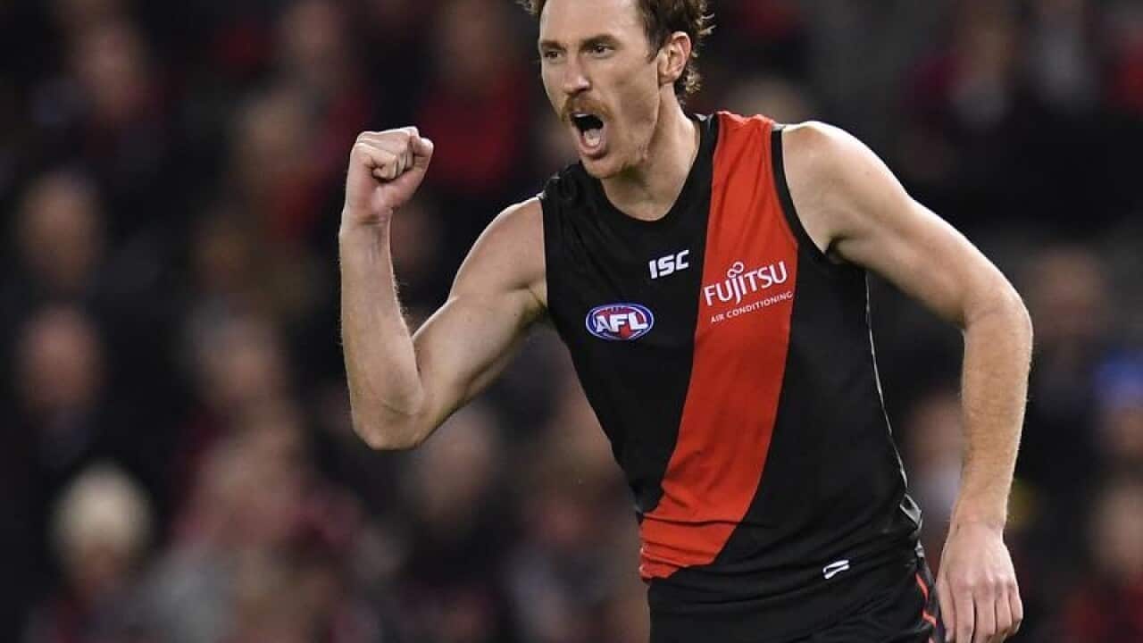 Mitch Brown of the Bombers reacts after kicking a goal