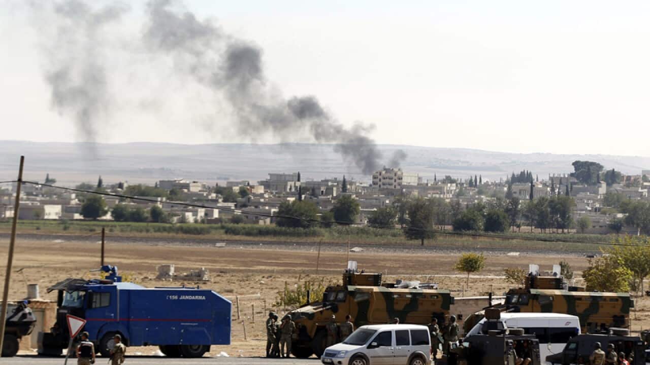 Smoke rises from Syria's Kobane city on the Turkish-Syrian border